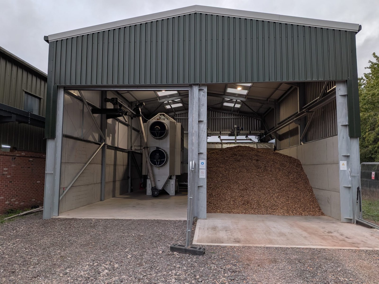 Eco T4 dryer and TopLoader fuel store in a shed